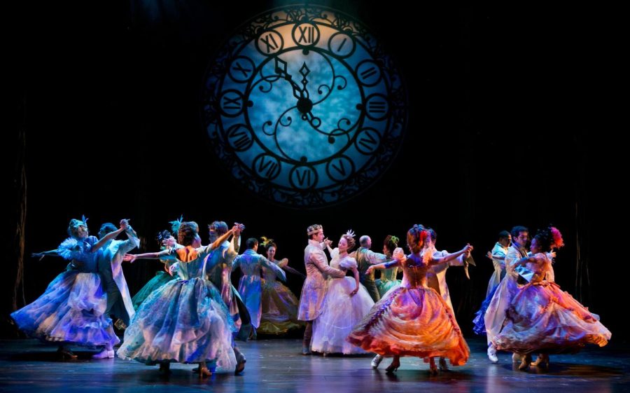 Picture from a Broadway performance of Cinderella: The Musical, including dancers at the ball and an ominous clock looming above them.