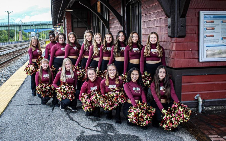 First ever Brunswick High School poms team Roaderettes posing infront of train station during their photo shoot. Photo courtesy of Sara Cooke.