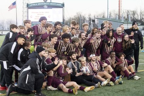 Brunswick Soccer posing with their trophy.