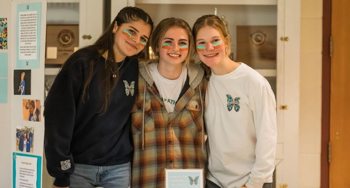 Carly Lindley (left), Paige Williams (middle), and Jenna Cackowski (right) at the Morgans Message basketball game. Photo provided and used with permission of Carly Lindley.  