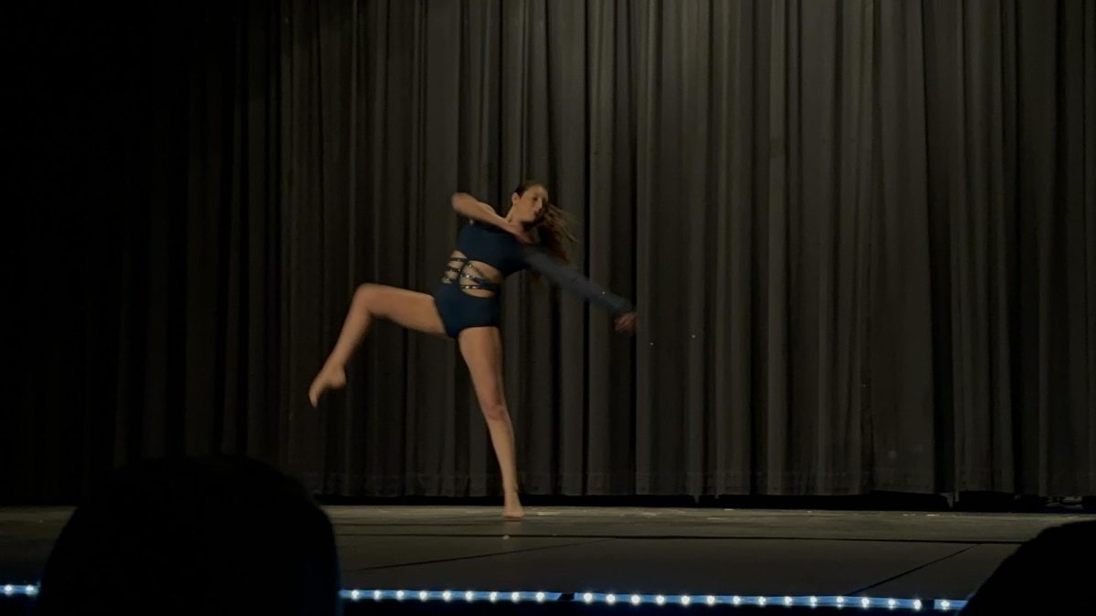 Sophomore, Izzy Zimmerman performing a contemporary solo.