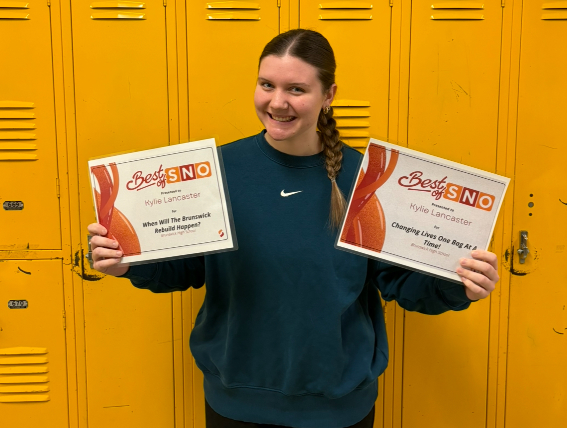Kylie Lancaster holding both of her Best of SNO awards. She was awarded her first Best of SNO in September and her second on Friday, March 22. 