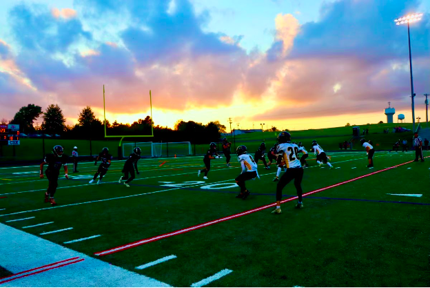 The Roaders brace for play under a beautiful fall night.