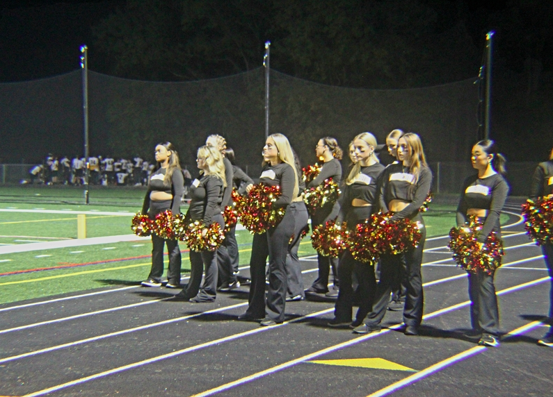 Poms waits to perform for the halftime show.