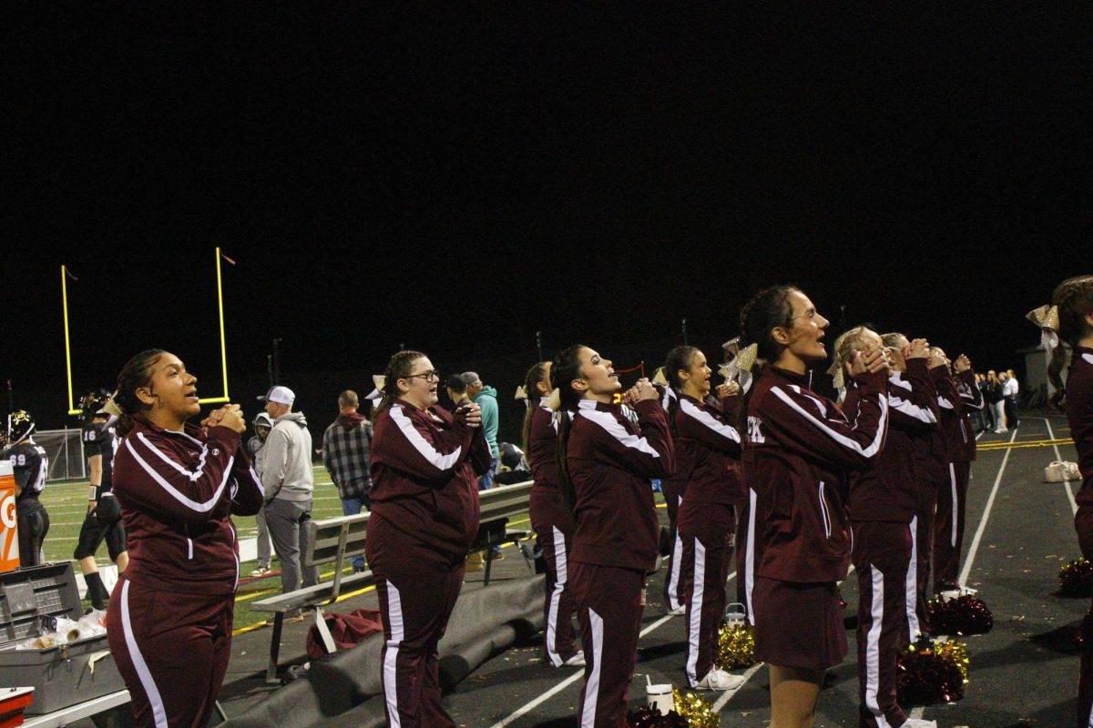 Cheer Squad gets excited for the start of the game.