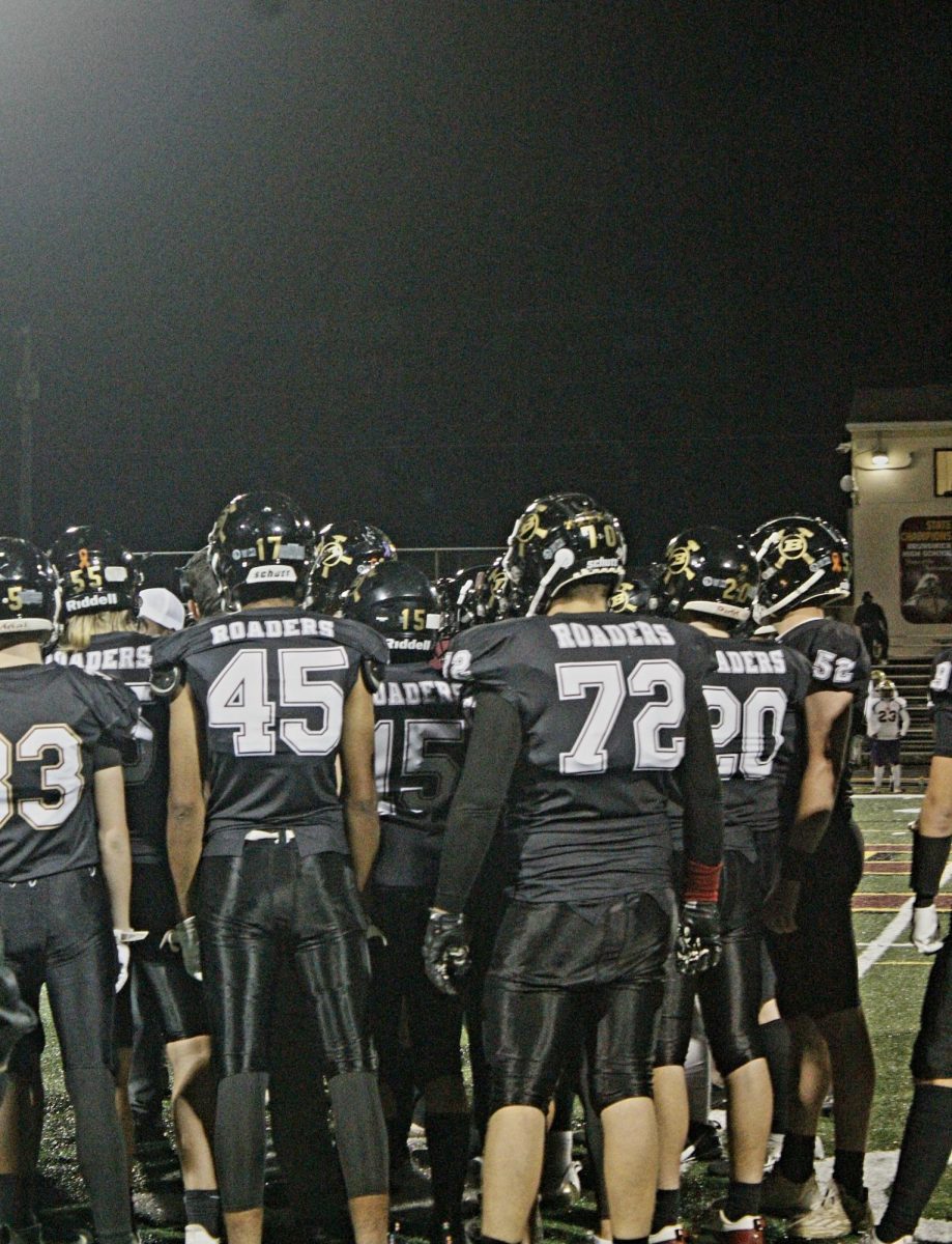 Roaders huddle to start the game.