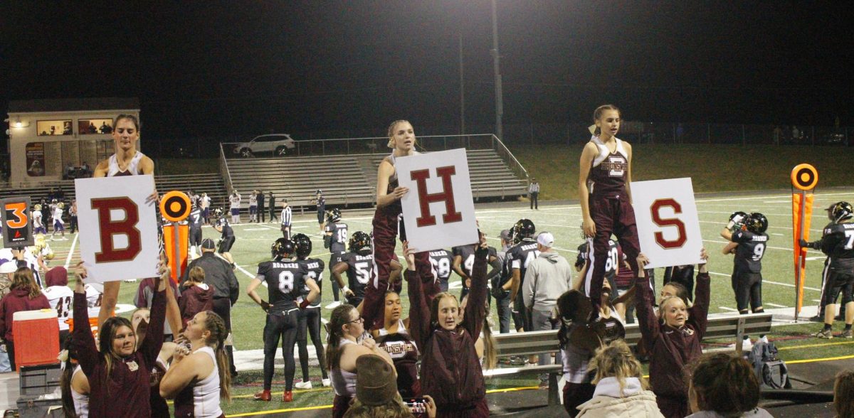 Students cheer "B H S" during the play! 