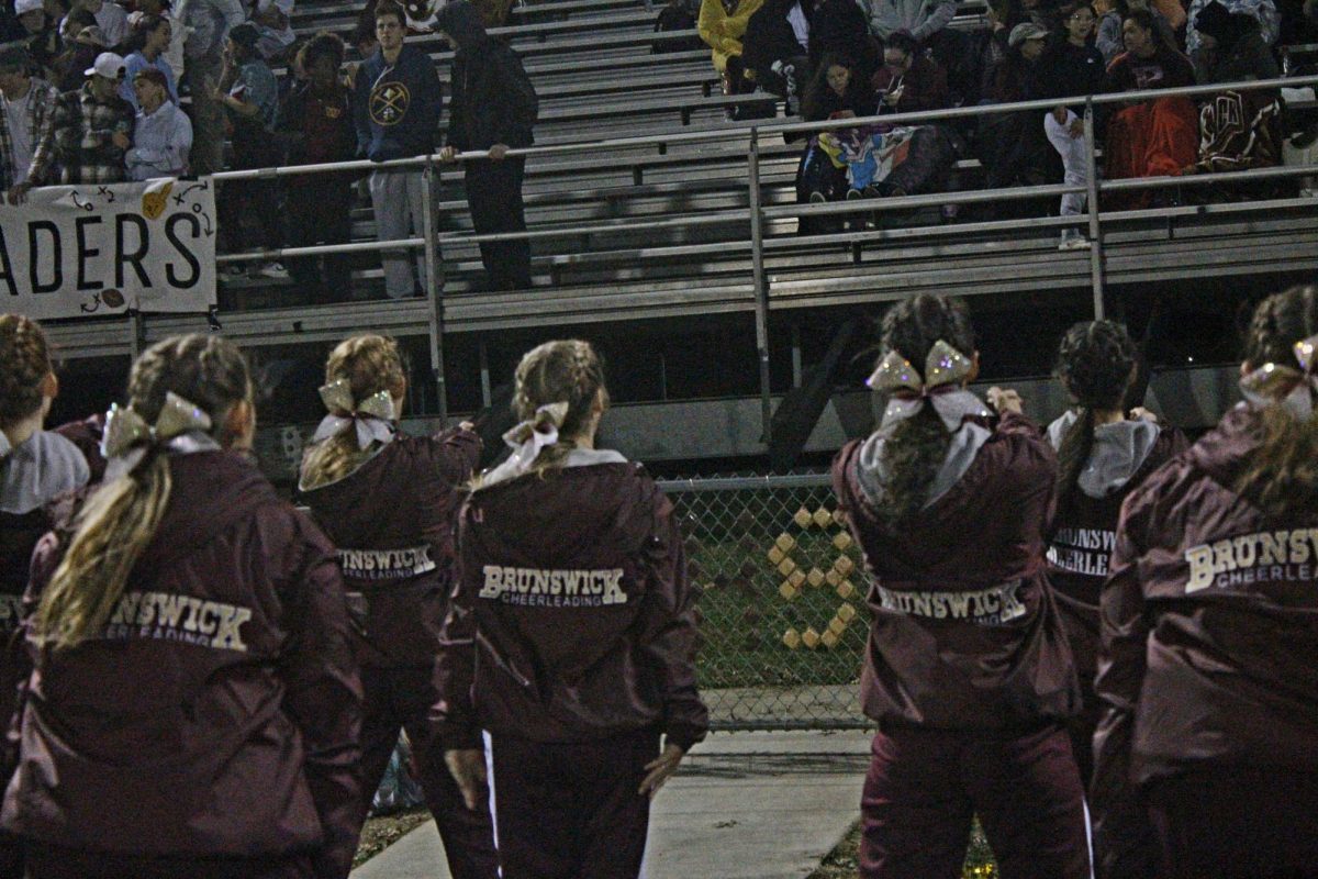 Cheerleaders look to fans to hype the Roaders.