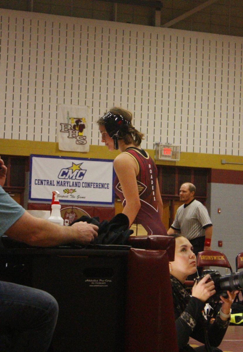 Kate virgilio walks away from the mat.  