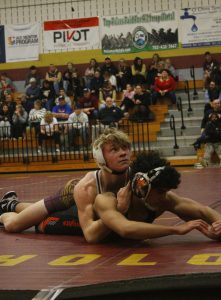 Cayden Boedecker has his opponent pinned.  