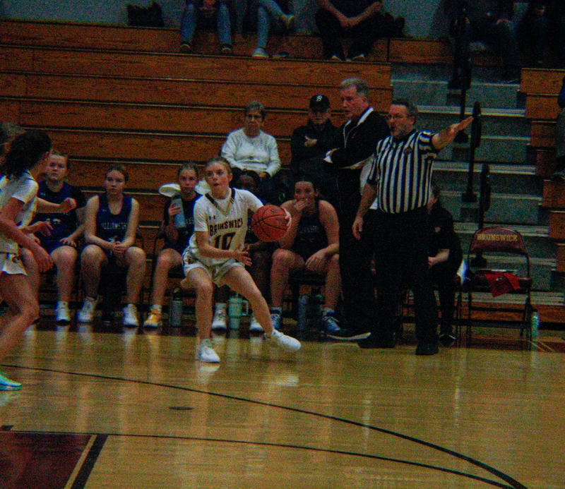 #10 Ava Higgins (Sophomore) dribbles the ball.