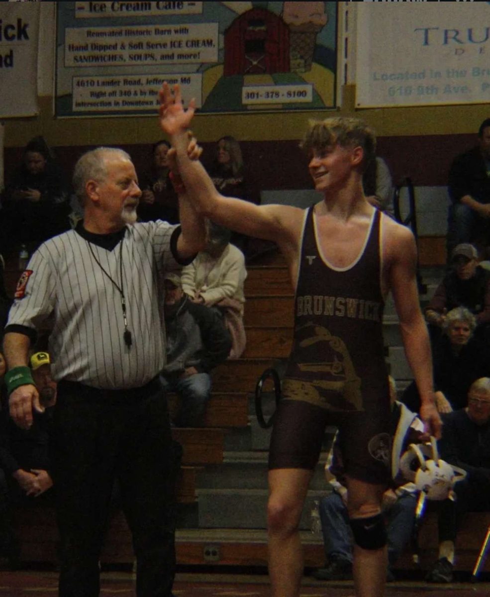 Cayden Boedecker, a sophomore, gets a victory after his match.