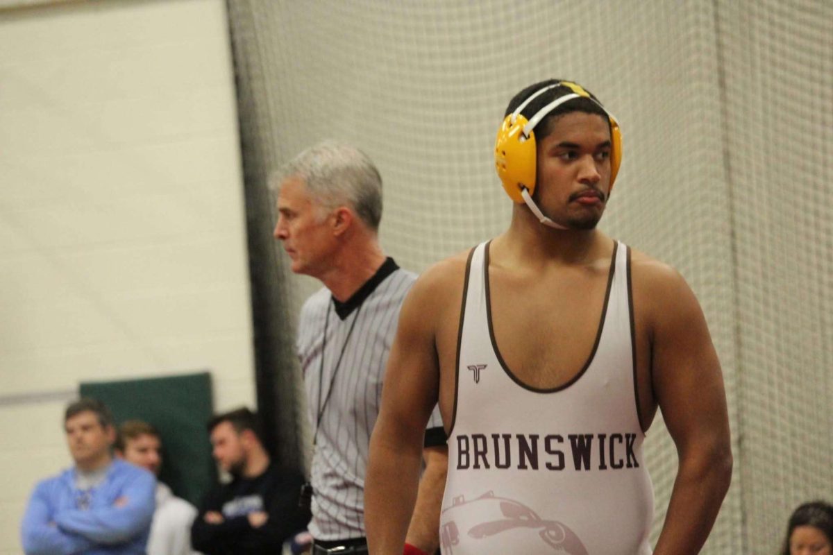 Austin Curry, a senior gets ready for his last match.