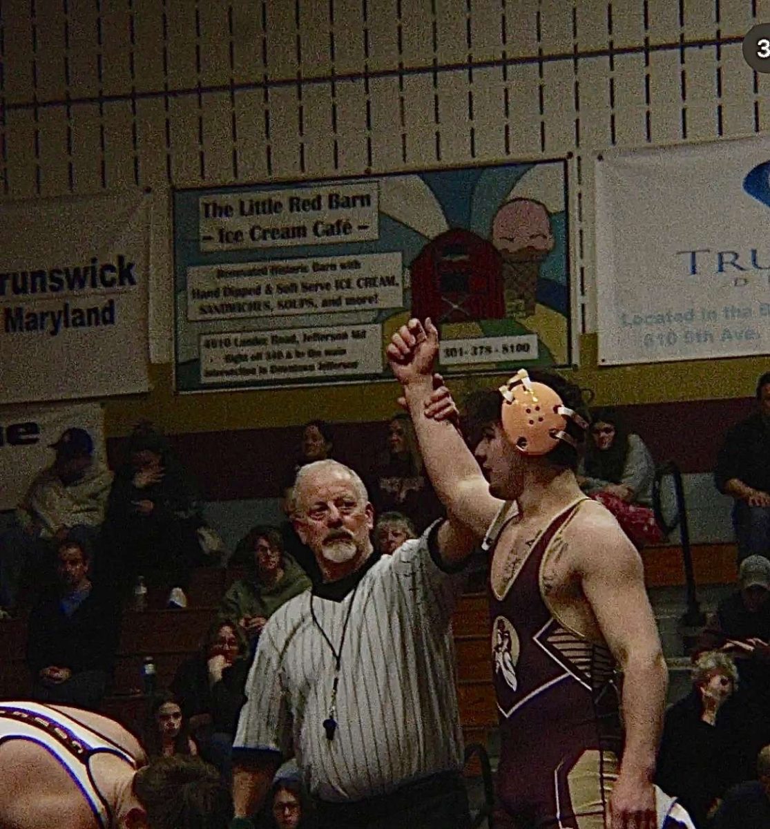 Alex Haste, a senior, wins his match.