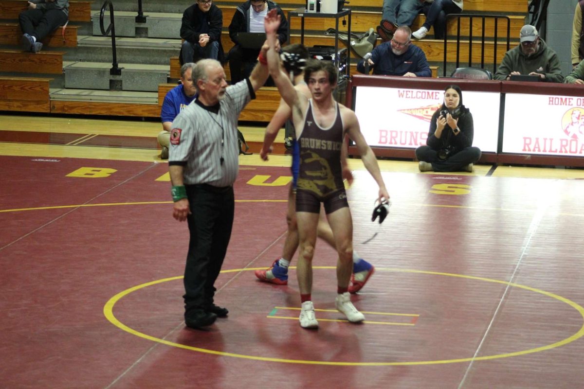 Evan Mullen, a senior, wins his match.