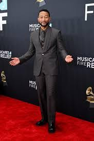 John Legend in Louis Vuitton. Legend was nominated for three Grammys and won Best Arrangement, Instrumental or aCapella. Adapted in Magic Studios by Caroline Teague