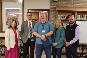 Mr. Curtiss Belcher standing with FCPS staff members as well as BHS principal, Mr. Eric Schwarzenegger, after being awarded FCPS and BHS support employee of the year. 