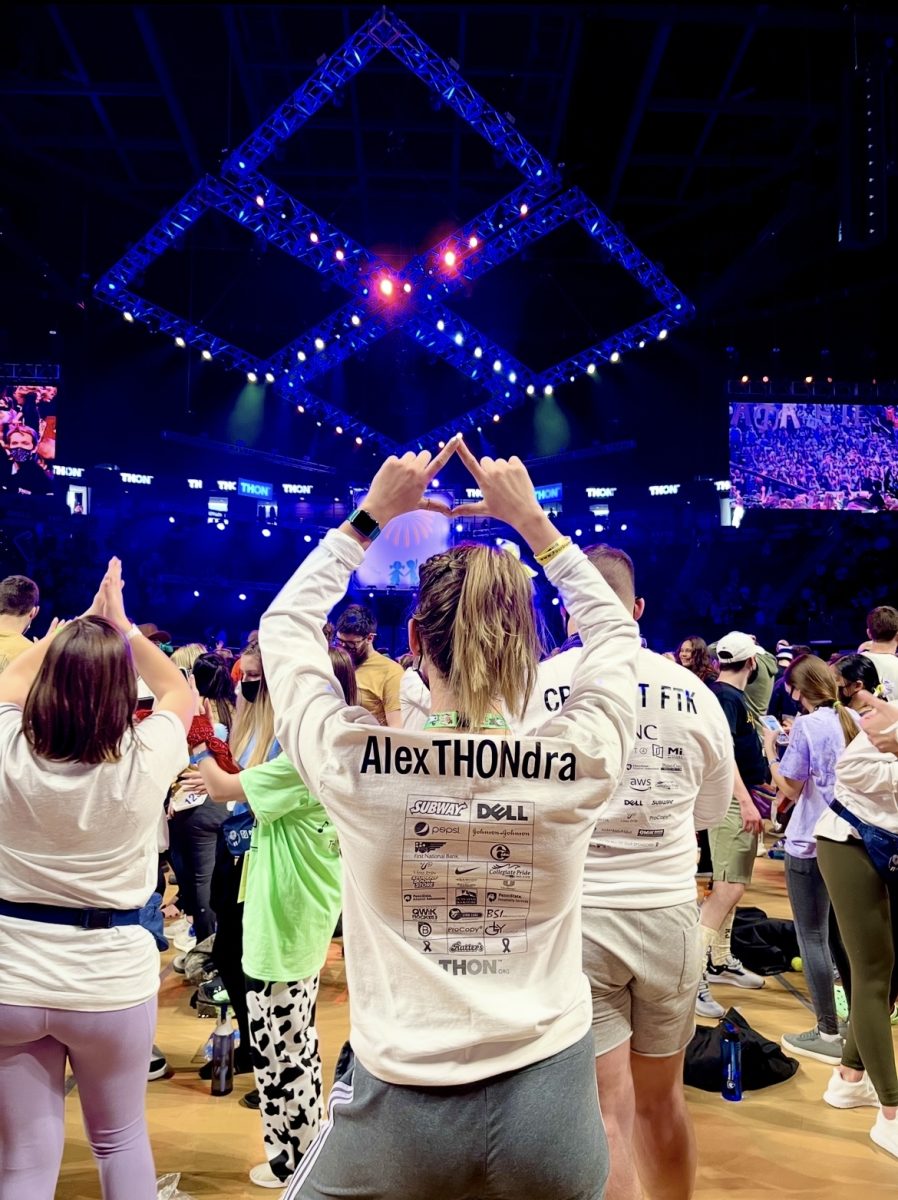 Alex Lilly showering her true love for THON by putting up her Four Diamond hands. Photo used with permission from Alex Lilly. 