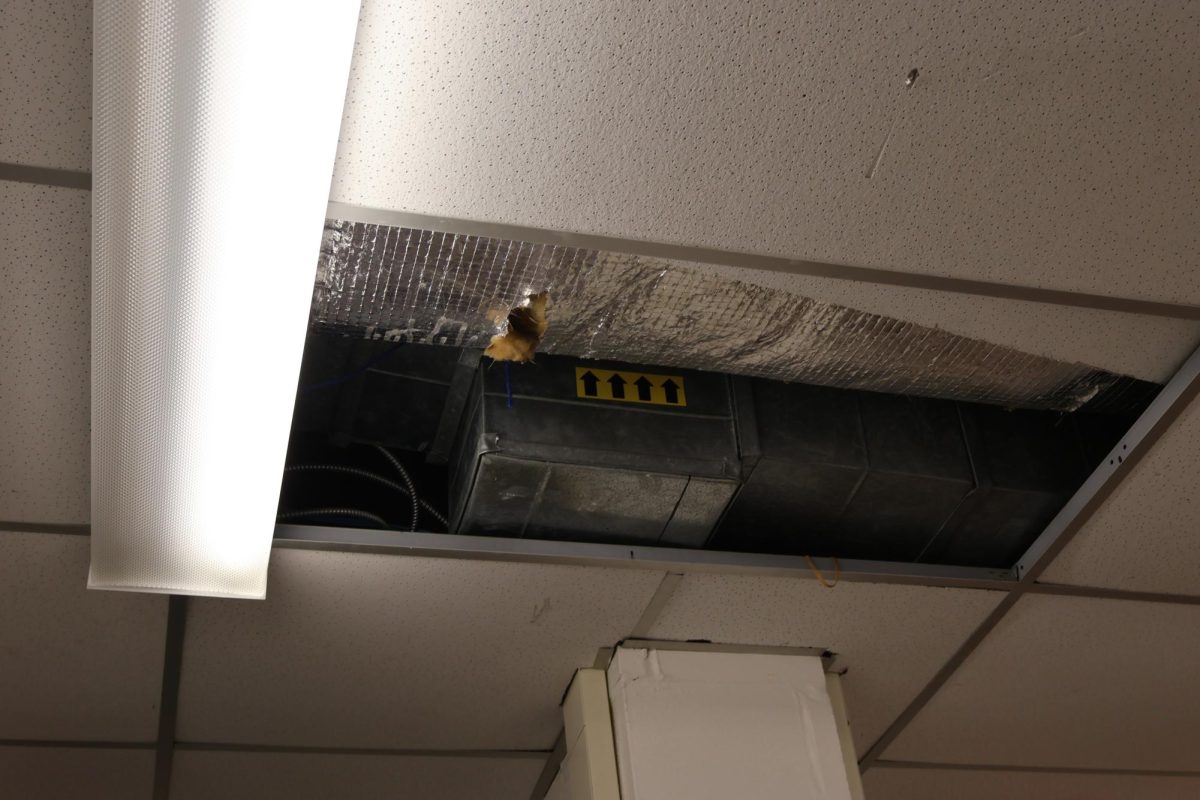 Missing ceiling tile, exposing the vents