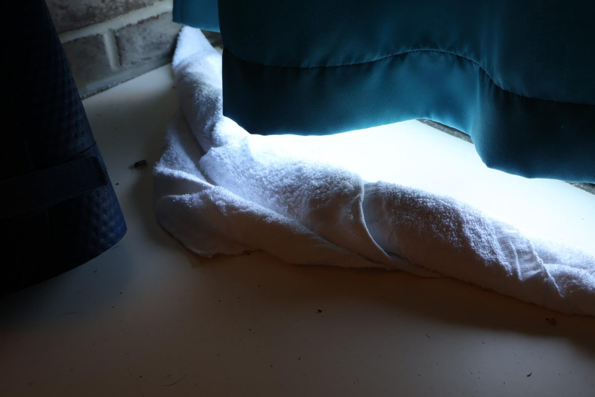 Towel used because the window leaks