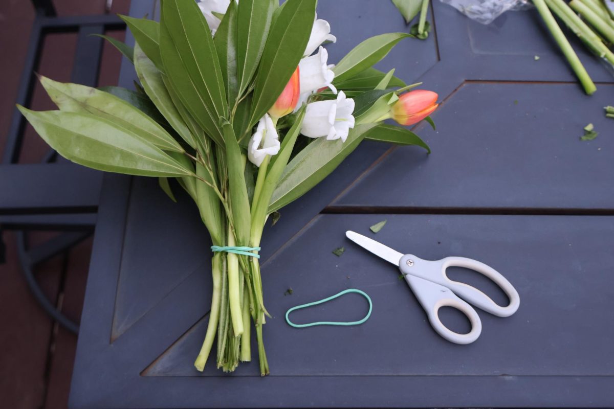 Once flowers are placed together it is time to cut the stems to your preferred length. This is when the rubber band comes into play.
