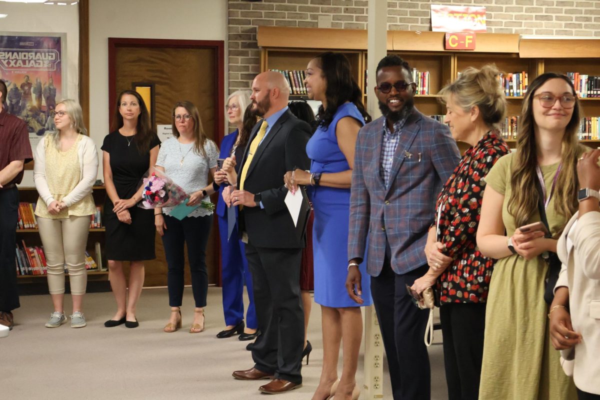 Many faces gathered around for the award ceremony.