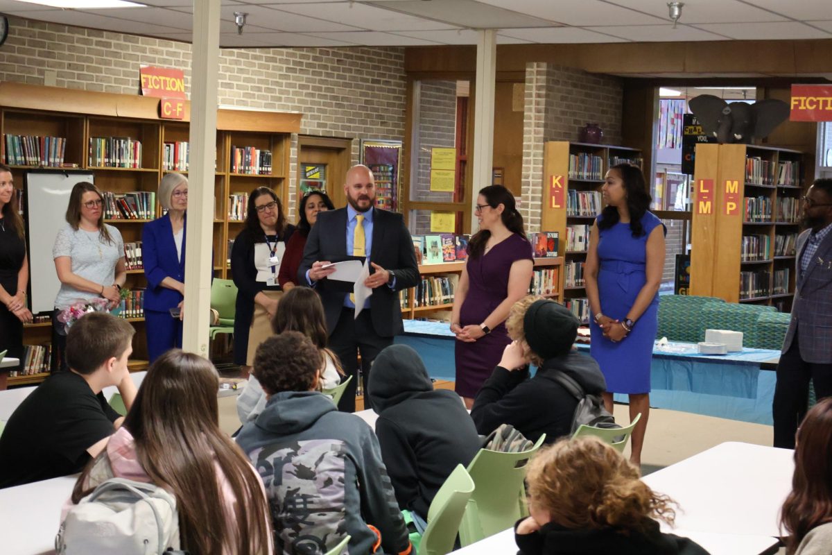 Mr. S discusses Ms. Kowalski's award to the students.