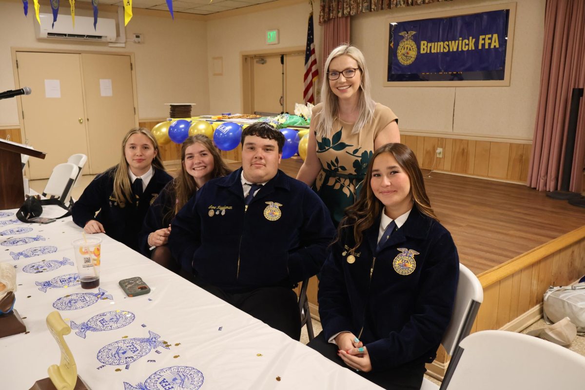 Mrs. Stockman posing with her FFA group members. From left to right Hannah Cook, Andie Welsh, Lane Riggleman, Mrs. Stockman, and Emma Pearrel. 