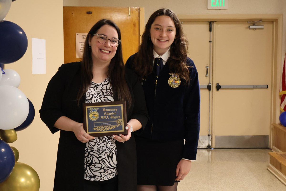 Mrs. Graziano and Atley Shafer, Junior, holding an award for an honorary FFA chapter given to Mrs. Graziano this year. She participated in every FFA fundraiser and is always a supporter! 