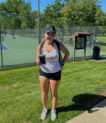 Aveline Murphy sporting her second place plaque after getting second in the county for second singles! Photo used with permission by Aveline Murphy.