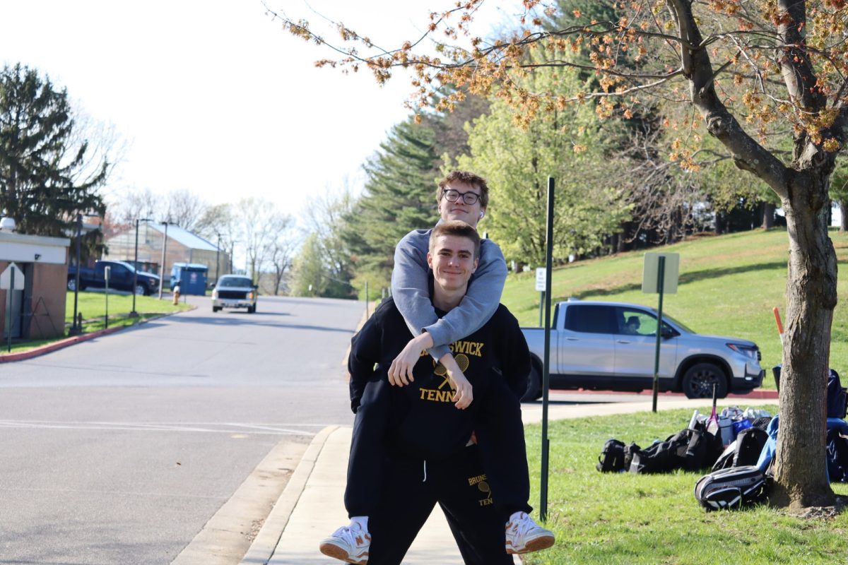 Colin Trendell sitting on Torin Connor's shoulders at an away match. Photo used with permission by Fred Heck.