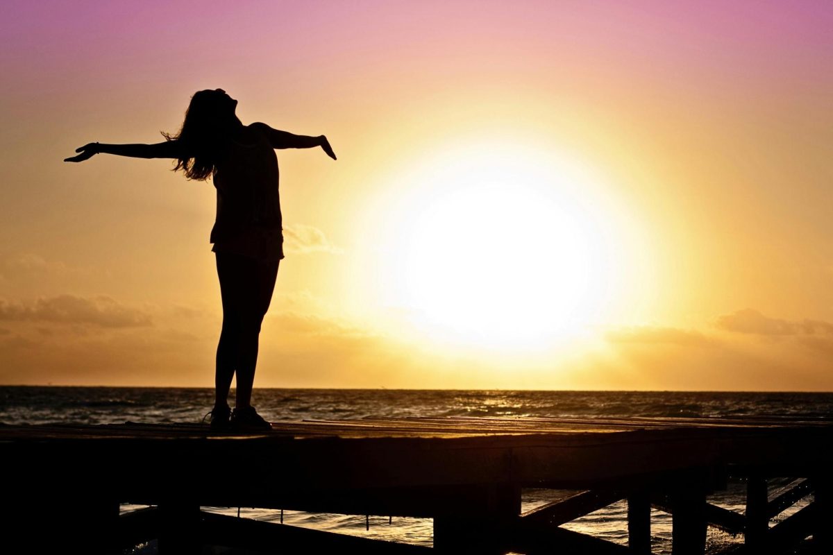 "Silhouette Photo of Woman Against during Golden Hour" by Jill Wellington is licensed under CC0. 
