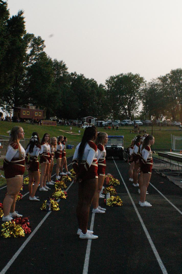 Brunswick Varsity Cheerleaders cheering on the football team.