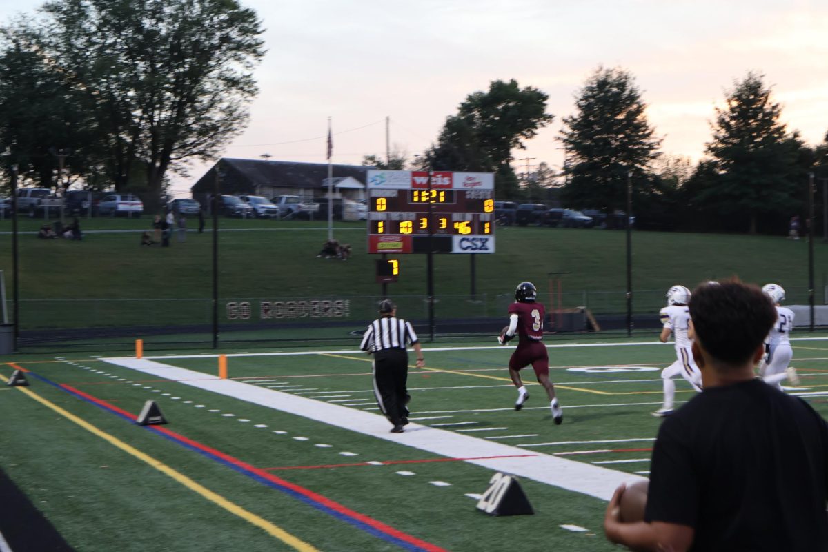 Barima Baffoe (senior) number 3, runs the ball in the first few seconds of the game scoring the team's first touchdown of the game.