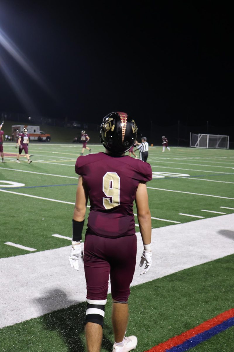 Senior, Austin Del Balzo walks out onto the field.