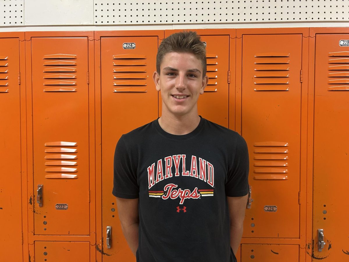 Brady Renn in front of lockers