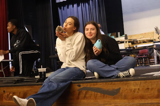 Lillian Cheeseman and Alaina Nielsen helping with cast and crew traditions.  