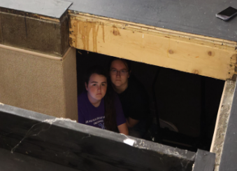 Vivian Frederick and Aley Peluso in the stage pit.