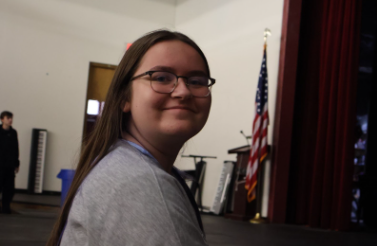 Vivian Frederick smiles briefly as a stage manager for "Robin Hood."