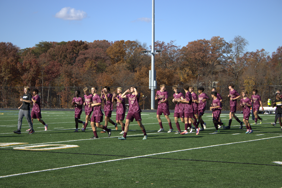 Team celebrates walking off the field.