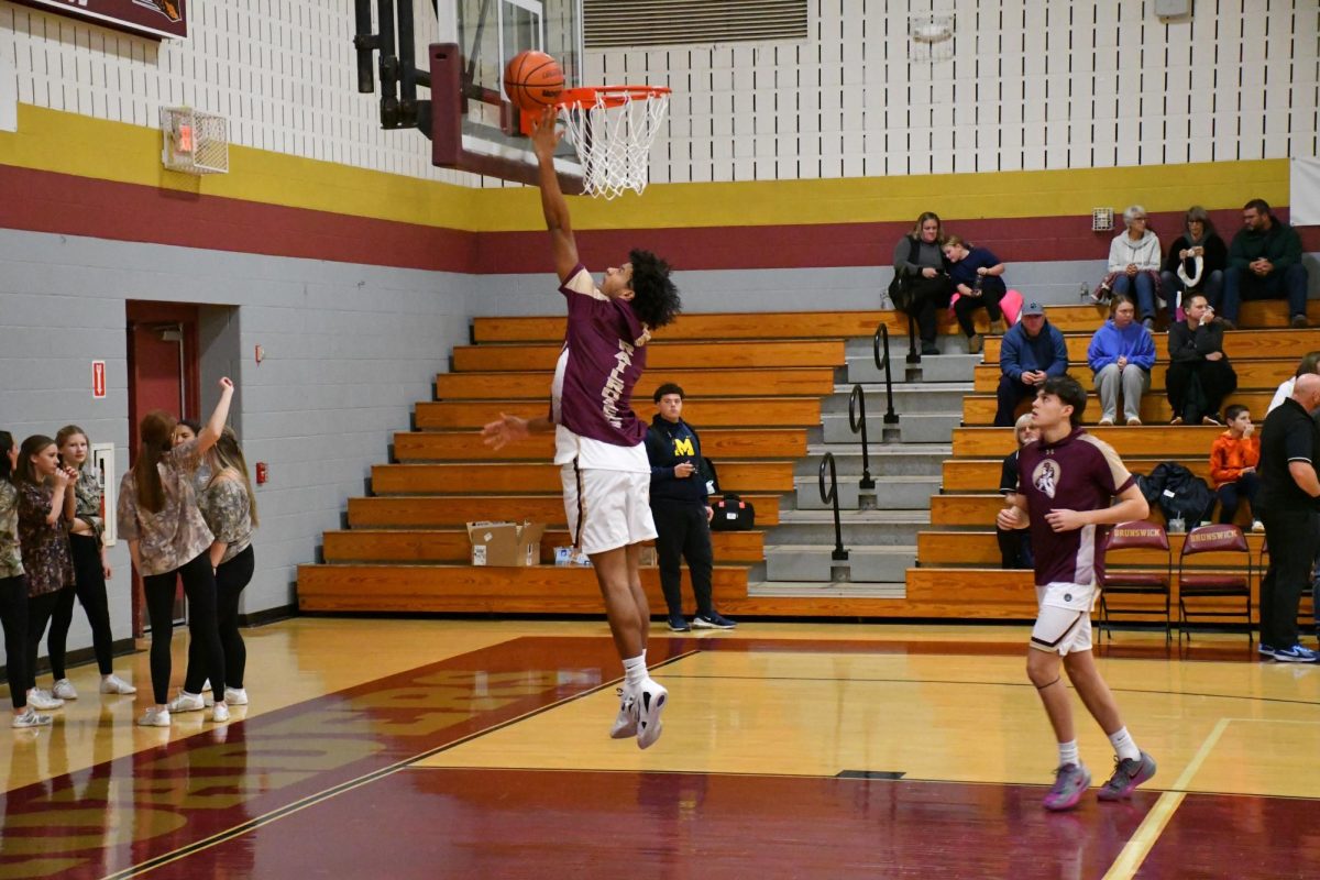 Jaivyn Moody, '29, practicing his layups prior to the varsity basketball game.

Photo taken by Lindsey Pearre
