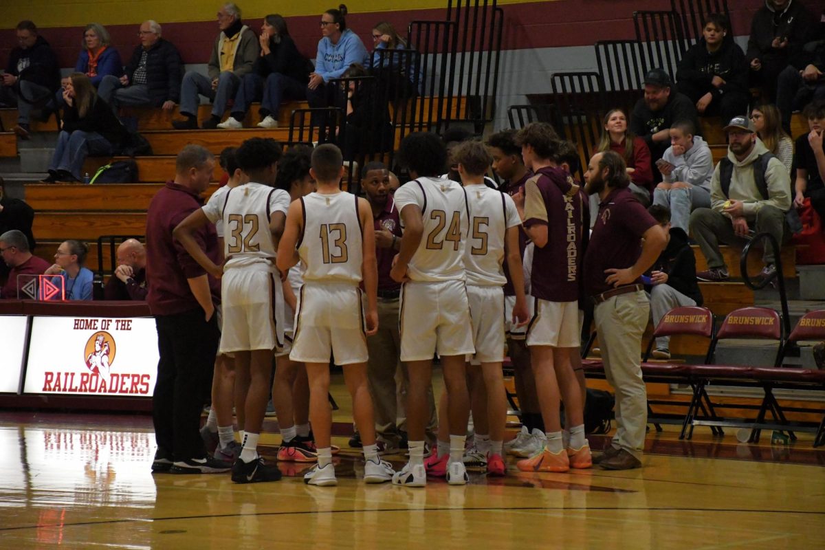 Boys' varsity basketball team huddles up during a timeout

Photo taken by Lindsey Pearre