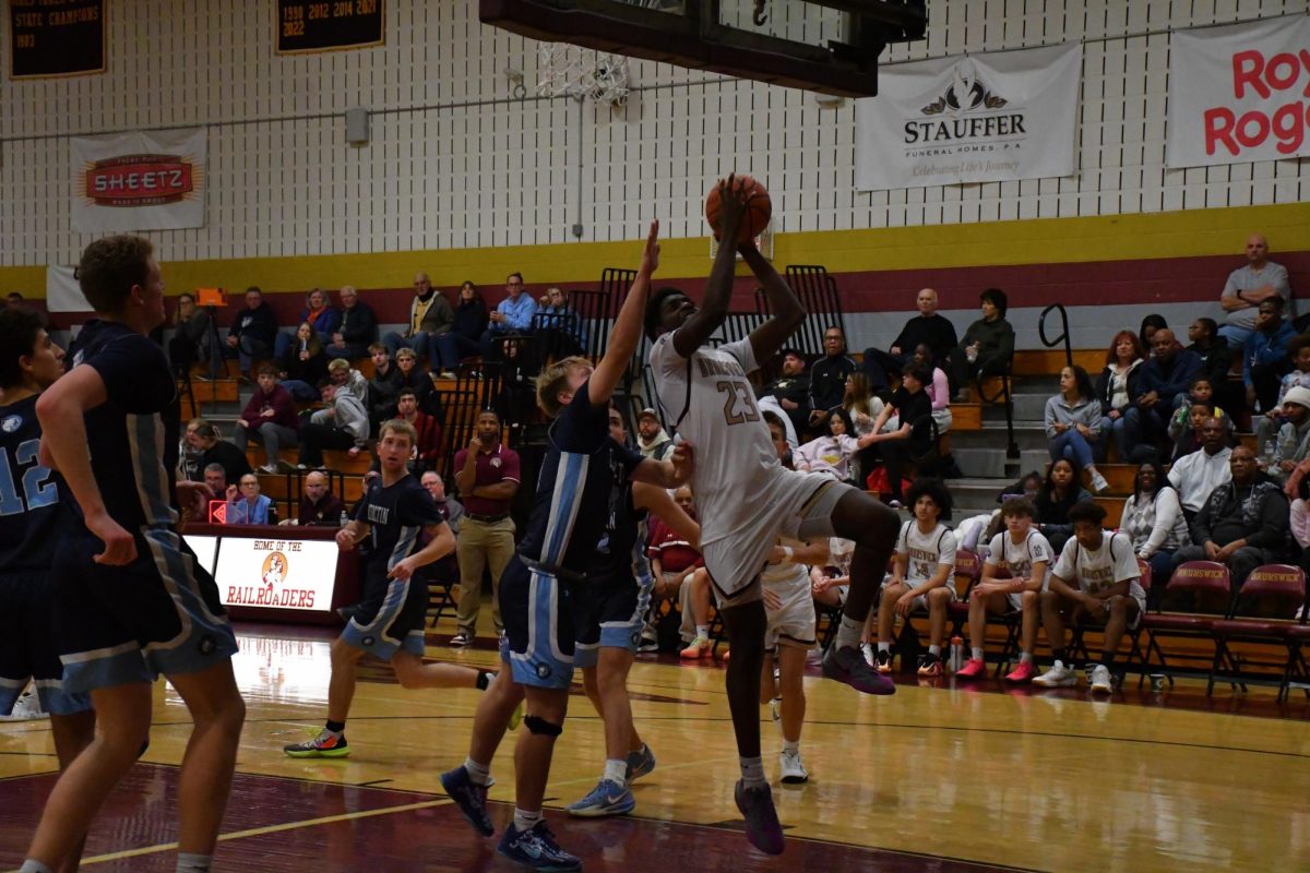 Mark Yongbi, '27, going in for a layup against Catoctin.

Photo taken by Lindsey Pearre
