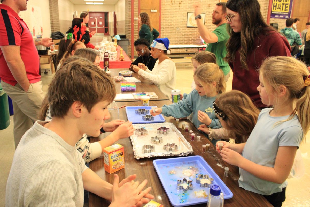 Students from the Science National Honors Society showing a science experiment.