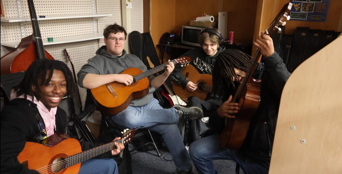 Braylen Richmond, James Sidelinger, Gabe Rodgers, Andre Phillips all play guitar while in class.