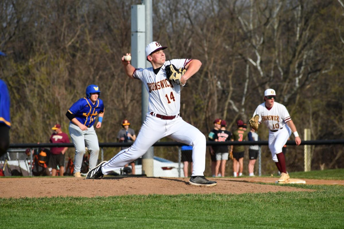 Logan Lowery, sophomore gets ready to throw a pitch to home plate.