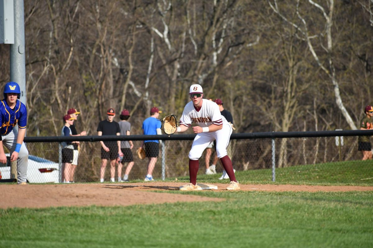 Judah Perks receives a ball at first base at warm ups.
