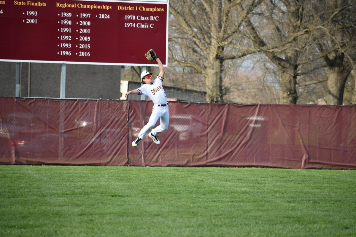 Owen Nugent, sophomore makes a leaping catch at the warning track.