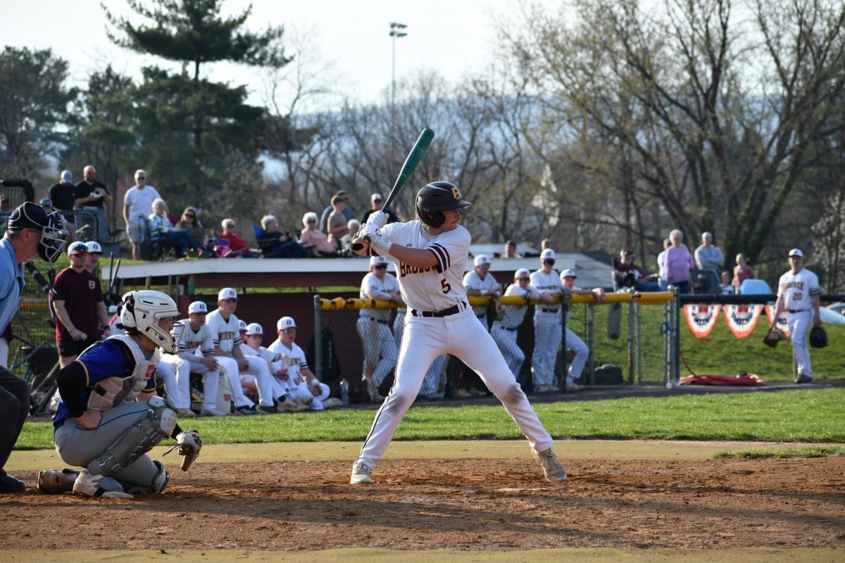 Landon Gregory defends the plate in hopes to have a hit to bring a run in.