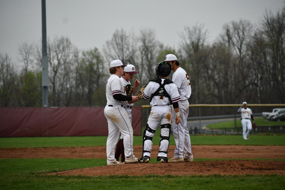 Players gathered on the pitchers mound.